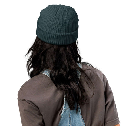 Person wearing Fischermütze N°0, a trendy ribbed knit beanie in teal, styled with casual outfit, perfect for cold weather.