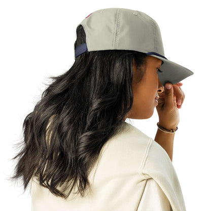 Woman wearing a stylish Golfcap with structured fit, adjustable snapback, and half-curved brim, ideal for casual outings.