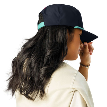 Woman wearing a Golfcap with a structured fit and adjustable snapback closure, perfect for adding classic style to any outing.