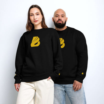 Models wearing Urbaner Pullover with oversized fit and round neckline, showcasing streetwear style in black with yellow logo.