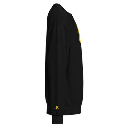 Urbaner Pullover in Schwarz, seitliche Ansicht, Oversized-Fit mit doppellagigem Stoff und gelbem Detail, ideal für Streetwear.
