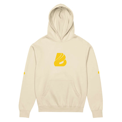 Beige Boxy-Hoodie für Herren with yellow logo on front, featuring a soft fleece material and oversized fit for comfort and style.
