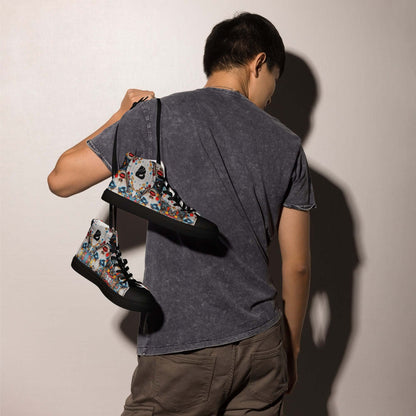 Man holding pair of colorful High-Top Leinenschuhe für Herren N°9 canvas shoes over shoulder, enhancing fashion style
