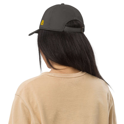 Person wearing the Bio-Dad Hat N°1 made from 100% organic cotton, viewed from the back to showcase unstructured design and adjustable strap.