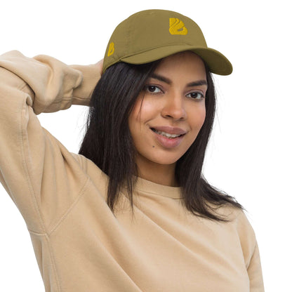 Woman wearing Bio-Dad Hat N°1 made from 100% organic cotton, showcasing eco-friendly fashion with a classic unstructured design.