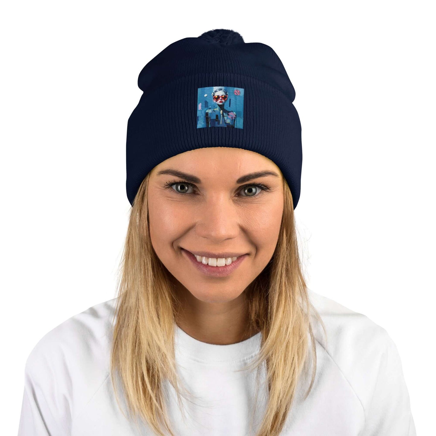 Woman wearing navy Bommelmütze with pom-pom, smiling