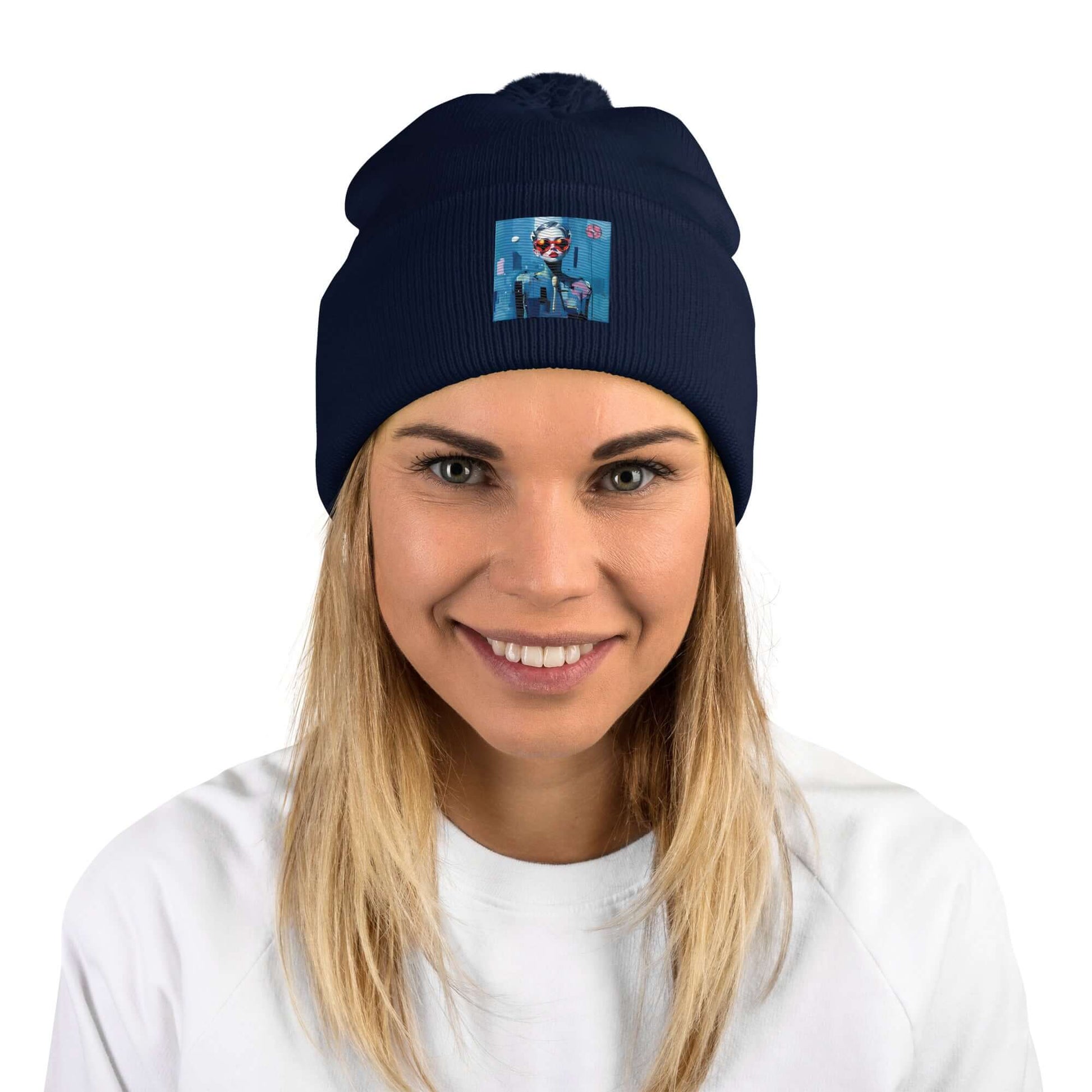 Woman wearing navy Bommelmütze with pom-pom, smiling