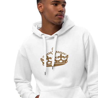 Young man wearing white hoodie with crown print, showcasing stylish streetwear.