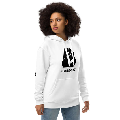 Woman wearing Hochwertiger Öko Kapuzenpullover N°13, a white hoodie made of organic cotton and recycled polyester with a stylish design.