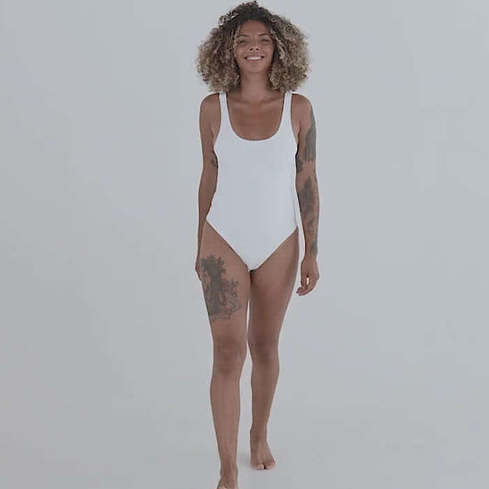 Model wearing Einteiliger Badeanzug N°0 in white showcasing a flattering fit and sleek design.