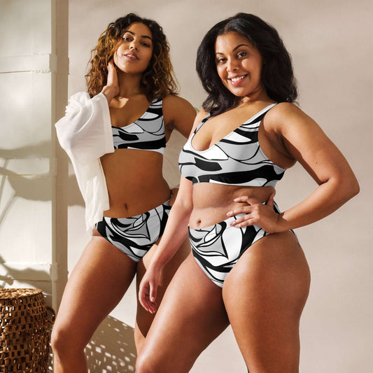 Two models wearing Recycelter Allover High Waist Bikini in a stylish black and white print, showcasing comfort and style.
