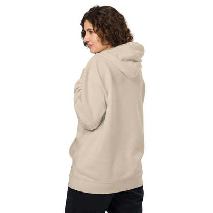 Person wearing beige Unisex Bio-Hoodie with recycled materials, showcasing sustainable streetwear fashion.