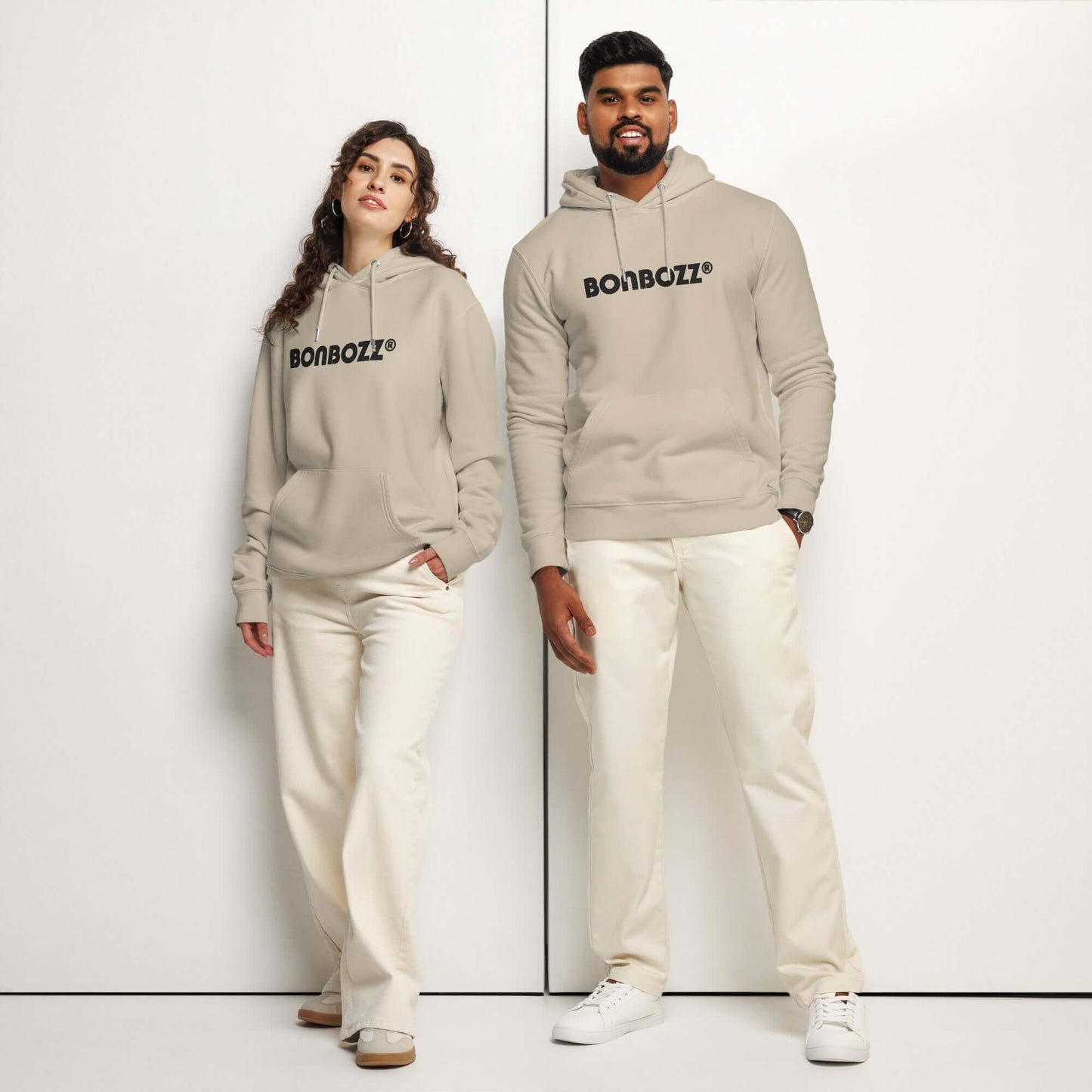 Unisex Bio-Hoodie in beige worn by a man and woman, highlighting comfort and eco-friendly style.