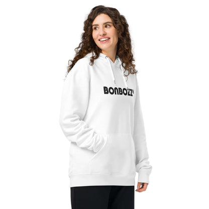 Woman wearing white "BONBOZZ" Unisex Bio-Hoodie with kangaroo pocket, showcasing streetwear style.