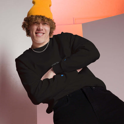 Person wearing a Unisex-Pullover with classic fit, smiling indoors with a yellow beanie, showcasing comfort and style for colder months.