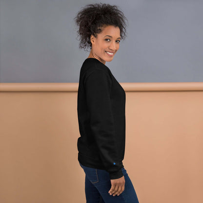 Smiling person wearing a black Unisex-Pullover, side view, showcasing classic fit and soft fabric against a neutral background.