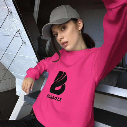 Person wearing a pink Bonbozz sweatshirt and gray cap sitting on stairs.