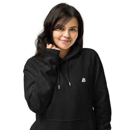 Person wearing a Unisex Bio-Raglan-Hoodie N°4 in black, showcasing casual comfort and style.