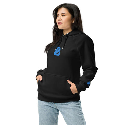 Model wearing Unisex Bio-Raglan-Hoodie N°3 in black, styled with jeans, showcasing comfort and casual fashion.
