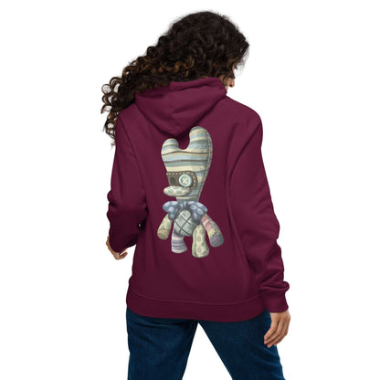 Woman wearing a burgundy Unisex Bio-Raglan-Hoodie N°4 with artistic design on the back, showcasing casual and stylish fashion.