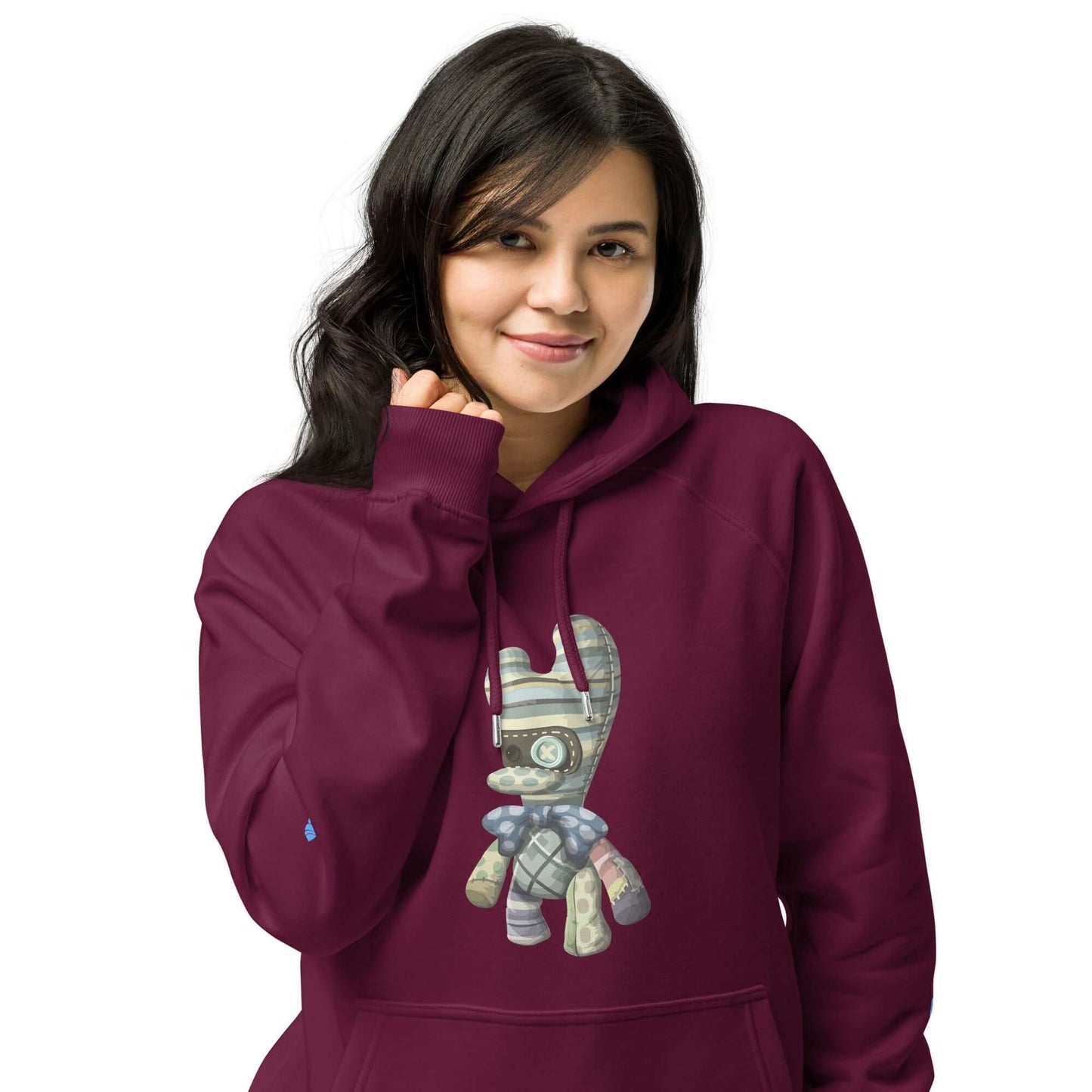Woman wearing a burgundy Unisex Bio-Raglan-Hoodie with a unique design.