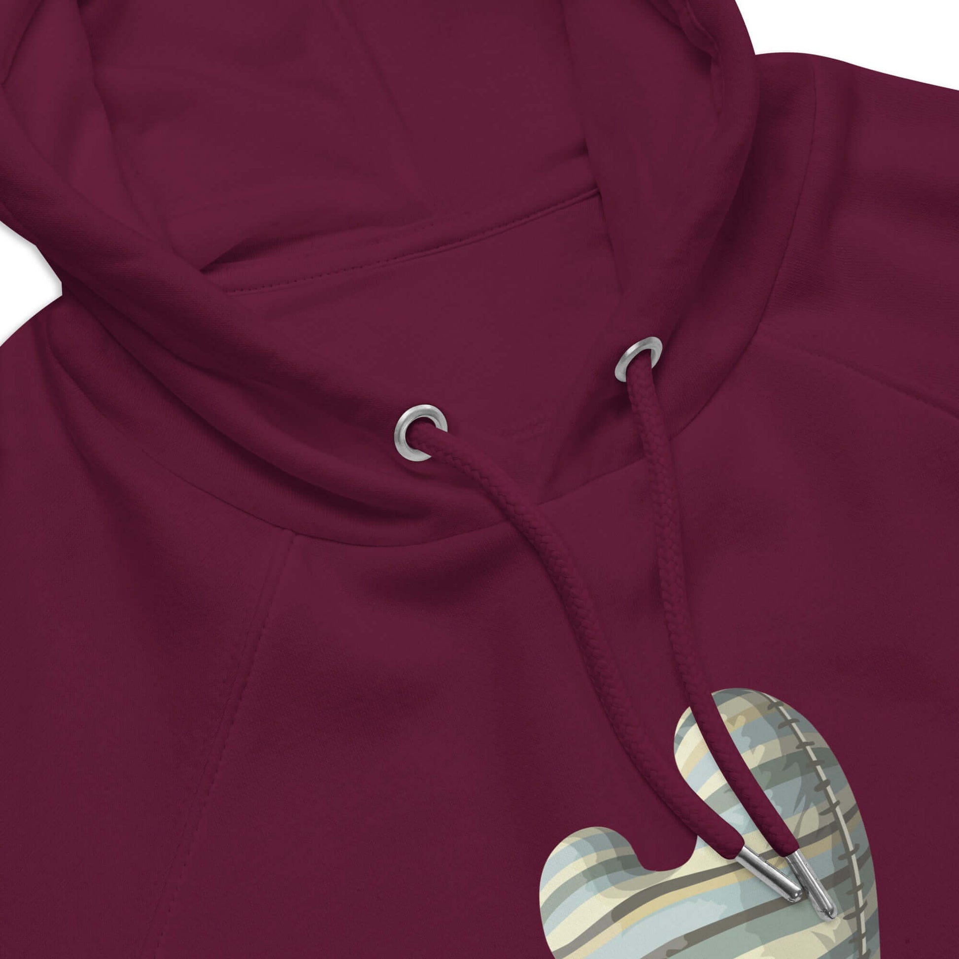 Close-up of burgundy Unisex Bio-Raglan-Hoodie with heart detail