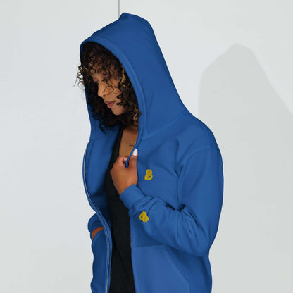 Person wearing a blue Unisex Heavy-Blend Zip Hoodie N°0 with hood up, featuring a robust zipper and soft fleece interior.