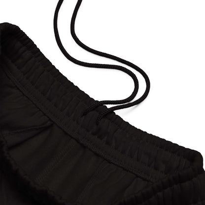 Schwere Jogginghose mit elastischem Bund und Kordelzug, Detailansicht der schwarzen gestreiften Kordeln und Taschen, 90er-Jahre-Stil