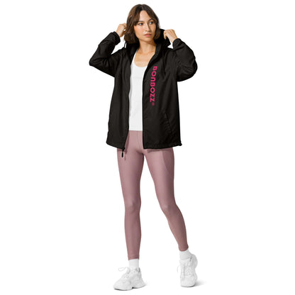 Woman wearing Leichter Unisex-Windbreaker mit Reißverschluss, showing front view and design details, perfect for outdoor adventures.
