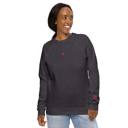 Model wearing Unisex Bio-Raglan-Pullover N°3, a stylish and comfortable sweater with 100% organic cotton outer layer.