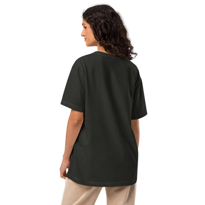 Rear view of a person wearing an Oversized-Unisex-T-Shirt in black, showcasing a comfortable, relaxed fit with a straight hem and short sleeves.