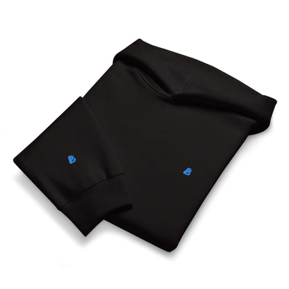 Schwerer Oversized Hoodie in Schwarz, aus gebürstetem Fleece, bequem und atmungsaktiv, liegend auf weißem Hintergrund.