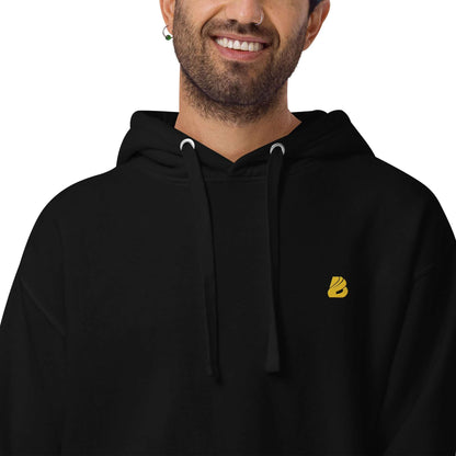 Unisex-Kapuzenpullover N°50 in black, showcasing a modern design with a front pouch pocket and warm hood, perfect for cool evenings.