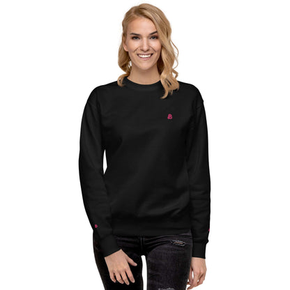 Model wearing Unisex-Premium-Pullover N°1 in black, showcasing ribbed neckline and cuffs for a trendy streetwear style.