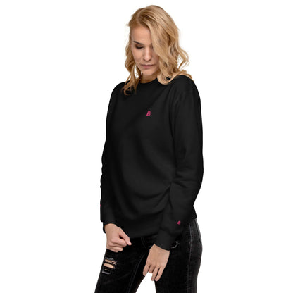 Woman wearing Unisex-Premium-Pullover N°1 in black, showcasing ribbed crew neckline and comfortable fit.