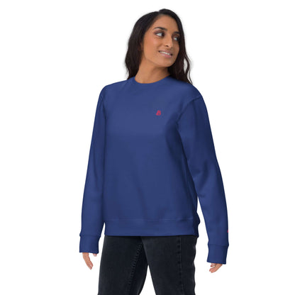 Person wearing Unisex-Premium-Pullover N°1, blue sweatshirt with ribbed crew neck and cuffs, perfect for stylish streetwear.