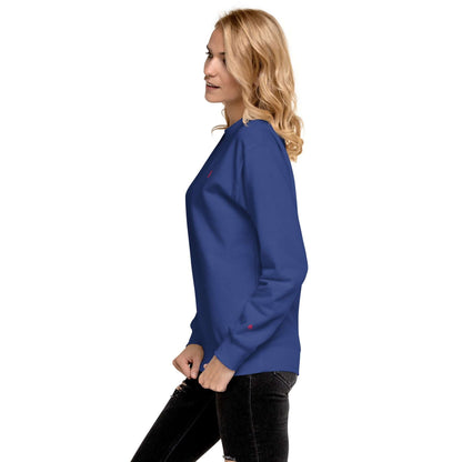 Side view of a woman wearing a blue Unisex-Premium-Pullover N°1 with ribbed neckline and long sleeves, perfect for streetwear style.