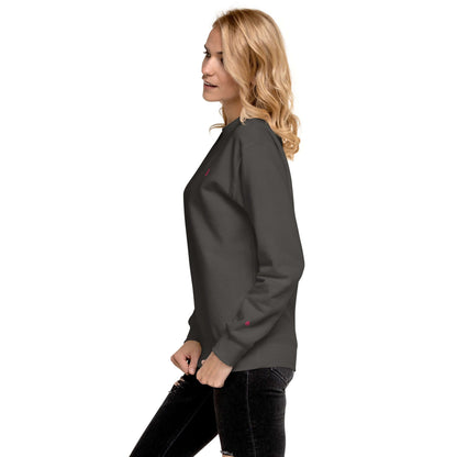 Woman wearing Unisex-Premium-Pullover N°1 in charcoal, featuring ribbed crew neck and cuffs.