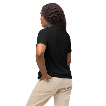 Rear view of person wearing black DryBlend® T-Shirt, showcasing modern fit and moisture-wicking fabric for versatile style and comfort.