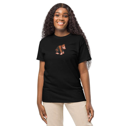 Smiling woman wearing black T-shirt with monkey graphic, standing against white background