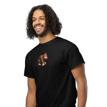 Man wearing black DryBlend® T-Shirt with monkey graphic, featuring moisture-wicking fabric for workouts and casual wear.