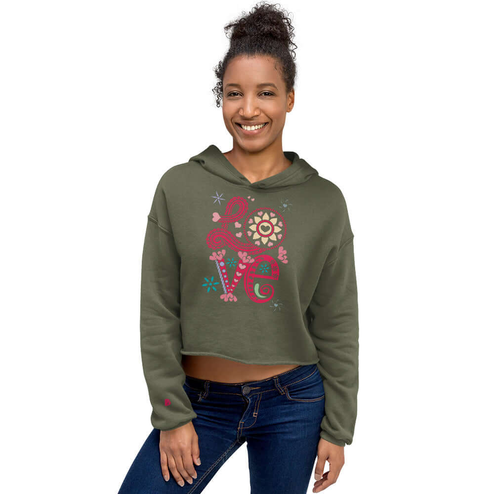 Model wearing a trendy Crop-Hoodie with open hem and matching drawstrings, perfect for a stylish wardrobe update.