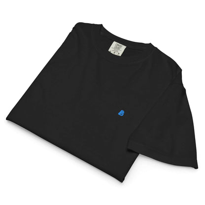 Schweres Damen T-Shirt im Boxy-Schnitt aus 100% Baumwolle, gefaltet in Schwarz mit minimalistischem Design und langlebigen Materialien.