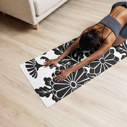 Person practicing yoga on a stylish Yoga-Matte N°0 with a floral pattern, featuring a non-slip rubber base and soft microvelour top.