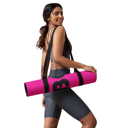Person carrying Yoga-Matte N°1, featuring pink color with straps, highlighting lightweight and portable design for yoga or meditation.