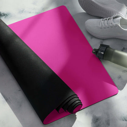 Yoga-Matte N°1 in pink with rolled edge, showcasing non-slip rubber bottom and microsuede top, next to white shoes and water bottle.