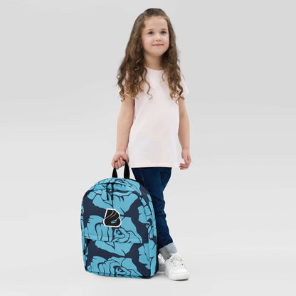 Child holding blue floral Rucksack N°4 for daily use and sports, featuring laptop pocket and waterproof polyester material.