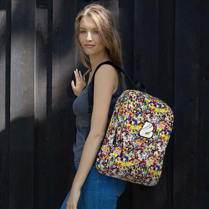 Young woman wearing Rucksack N°3, a colorful, medium-sized backpack ideal for daily or sports use, with a weather-resistant material.