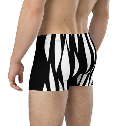 Model wearing Boxer-Briefs N°1 with black and white pattern, showcasing comfort and style with no back seam and mid-waist fit.