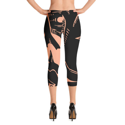 Back view of Capri-Leggings N°3 showcasing black and peach abstract design, made of soft, stretchy fabric for comfort.